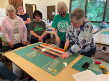 Camp Huston, learning Quick Log Cabin Strip Cutting Method