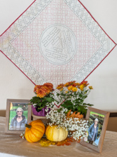 A celebration montage with quilt, photos & flowers