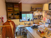 Penny's central cutting table & 2 machines under the window